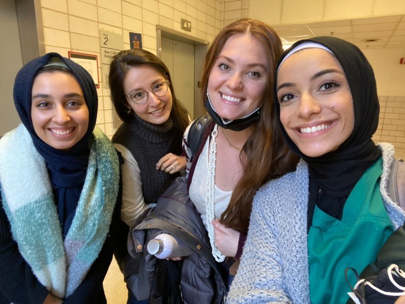 Drexel University physician assistant student Arkann Al-khalilee standing in a hall way with three female classmates